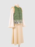 Full side view of the green vest featuring panda embroidery at the hem