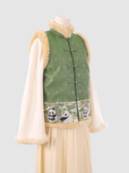 Side angle of the green embroidered vest with khaki fur binding