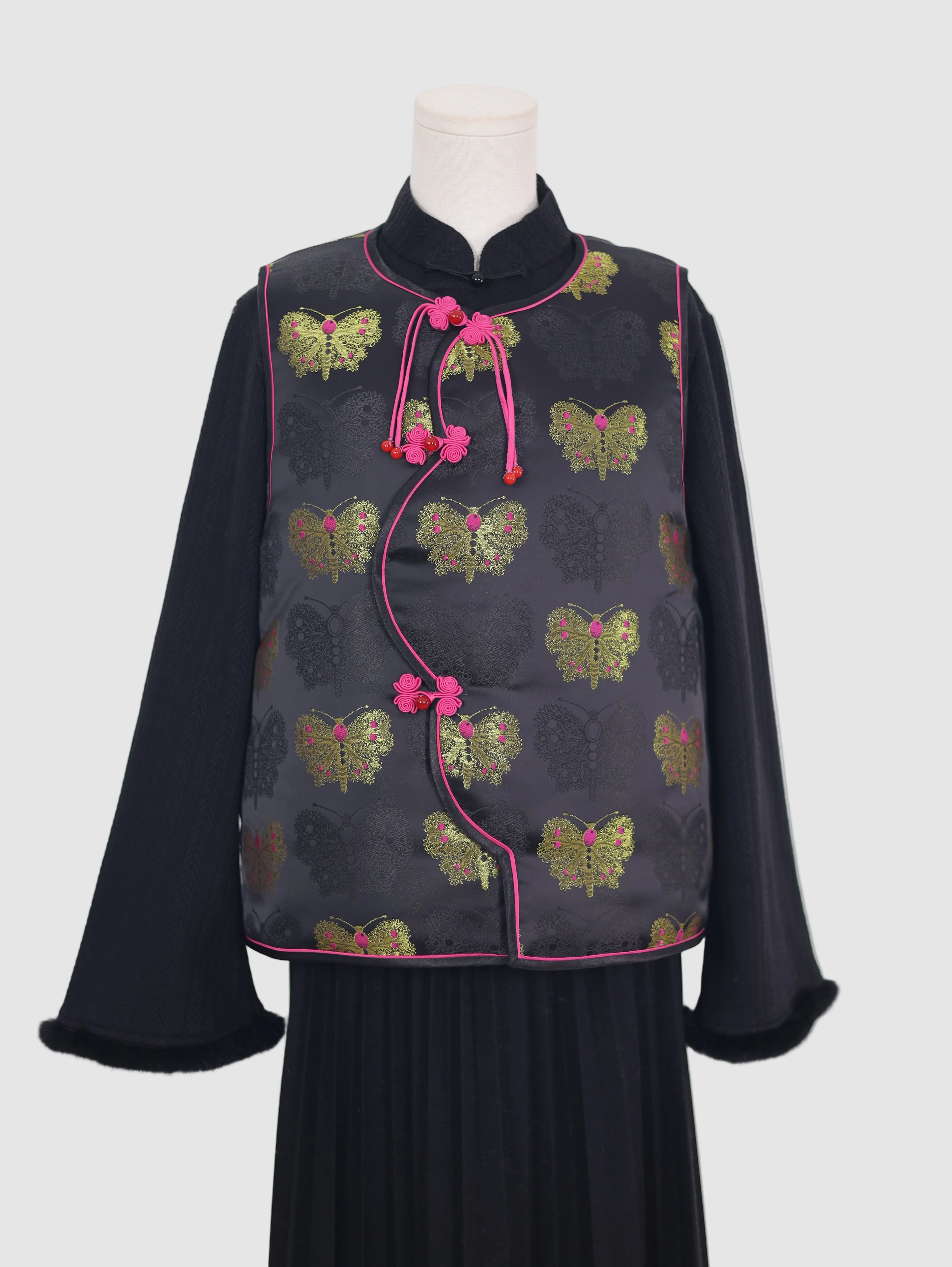 Half front view of butterfly pattern vest with curved wave-front design