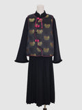 Front view of black butterfly jacquard vest with pink piping and frog button closure