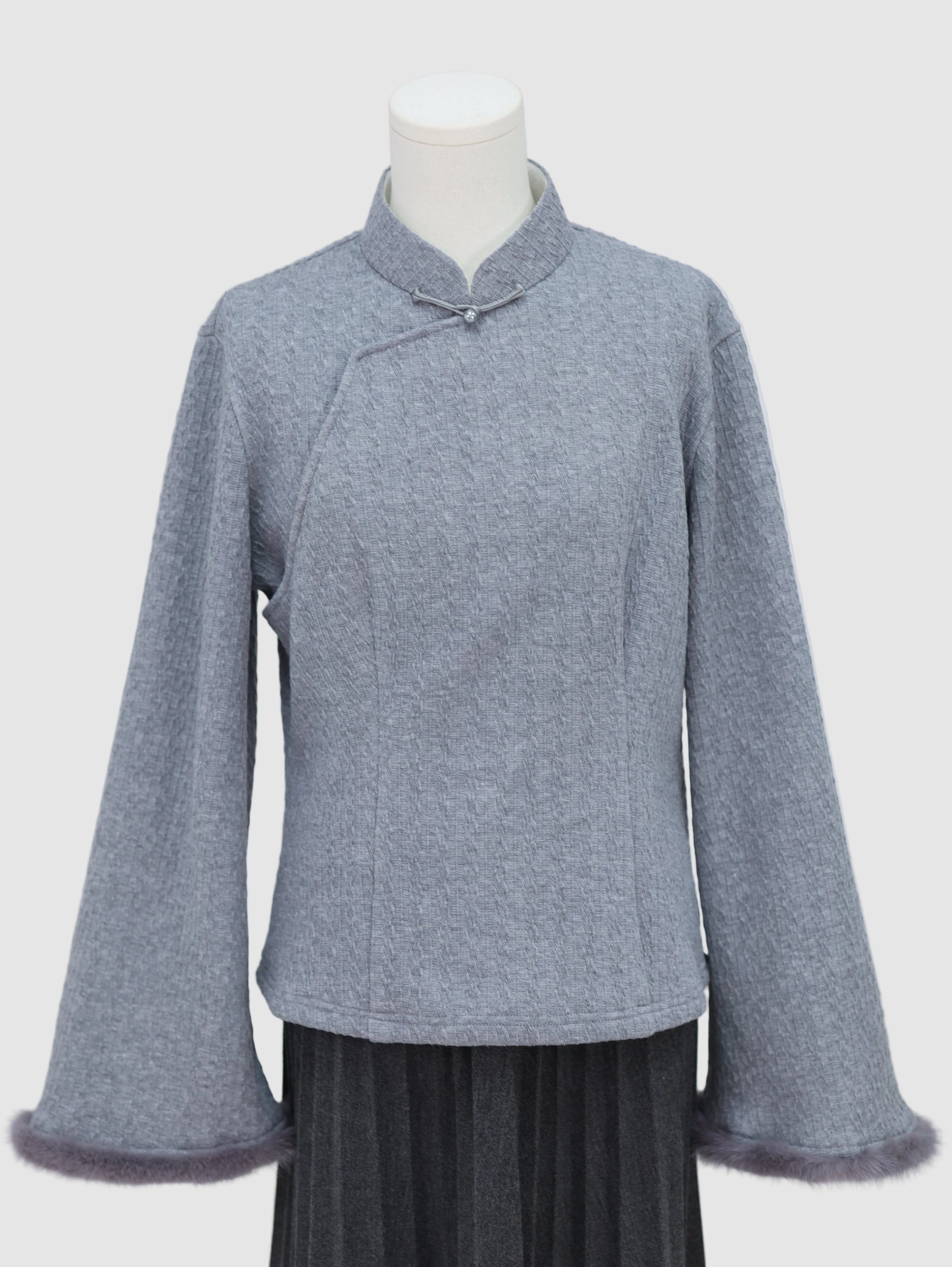 Wide-sleeve knitted fleece-lined base layer top with stand collar and frog button detail, front view