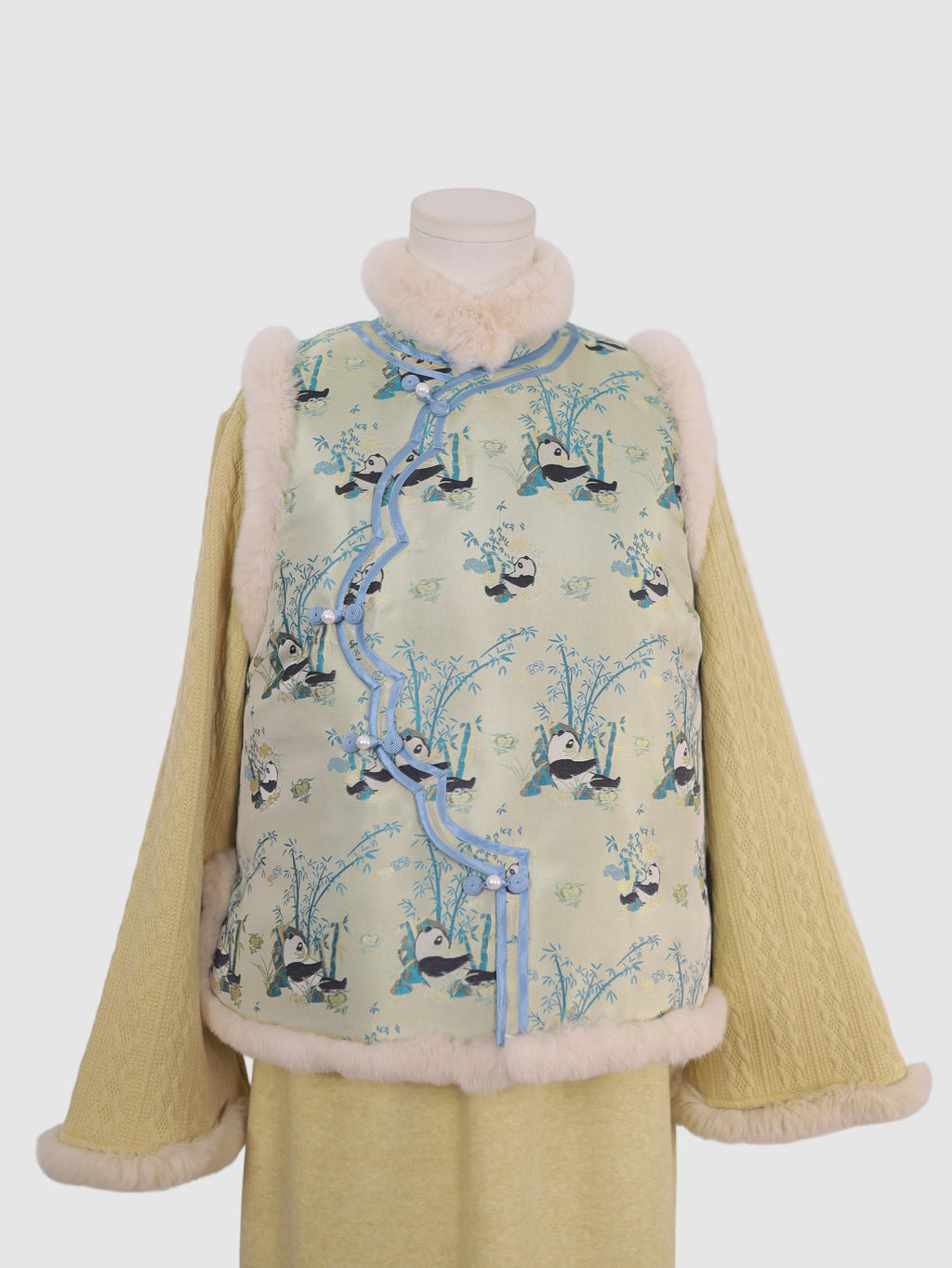 Front view of pastel green panda wave-front vest with real rabbit fur trim and padded lining