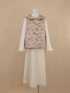 Front view of persimmon and cat print vest with rounded collar and frog buttons