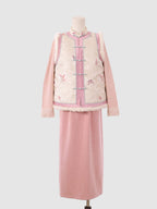 Pink and white butterfly jacquard vest with rabbit fur trim and frog button closure, front view