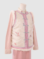 Side half view of pink and white butterfly jacquard vest showing silhouette and fur edging