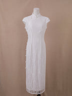 White lace wedding qipao cheongsam, ankle-length with mandarin collar, floral lace, and pearl side closure – front view.